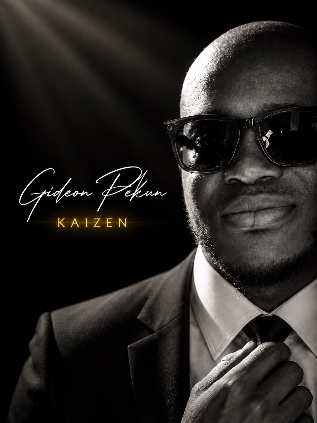 Black-and-white portrait of Gideon Pekun wearing sunglasses and adjusting his tie